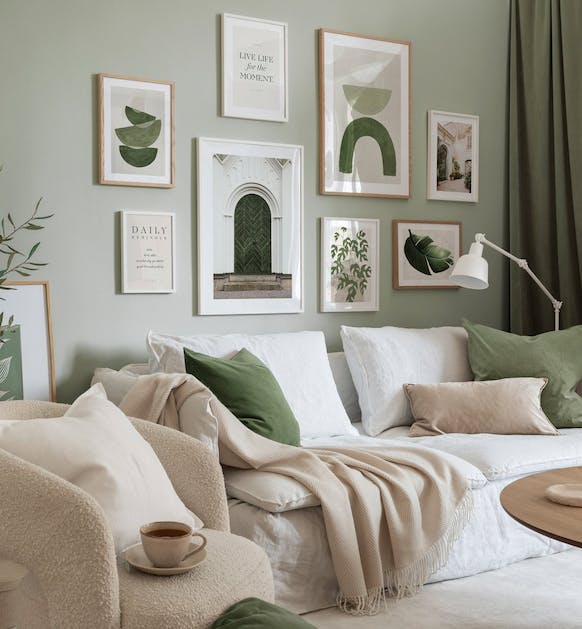 Modern gallery wall in green of graphic, quotes and architecture posters with oak and white wood frames for living room